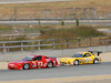 thumbnail image of a red car leading a yellow car